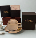 Elyn Coffee packaging with a cup and saucer on a light background