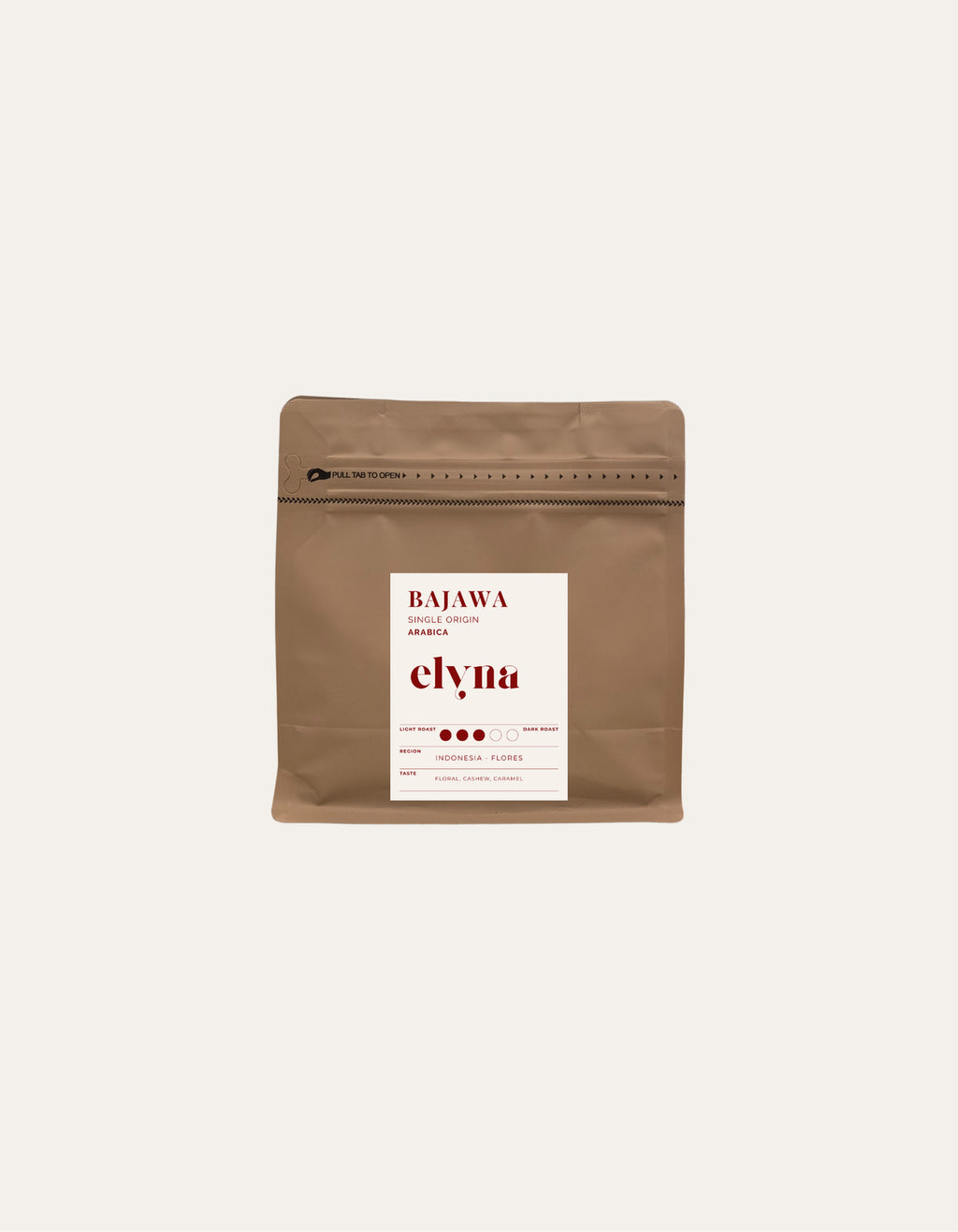Brown coffee packaging with a white label on a beige background