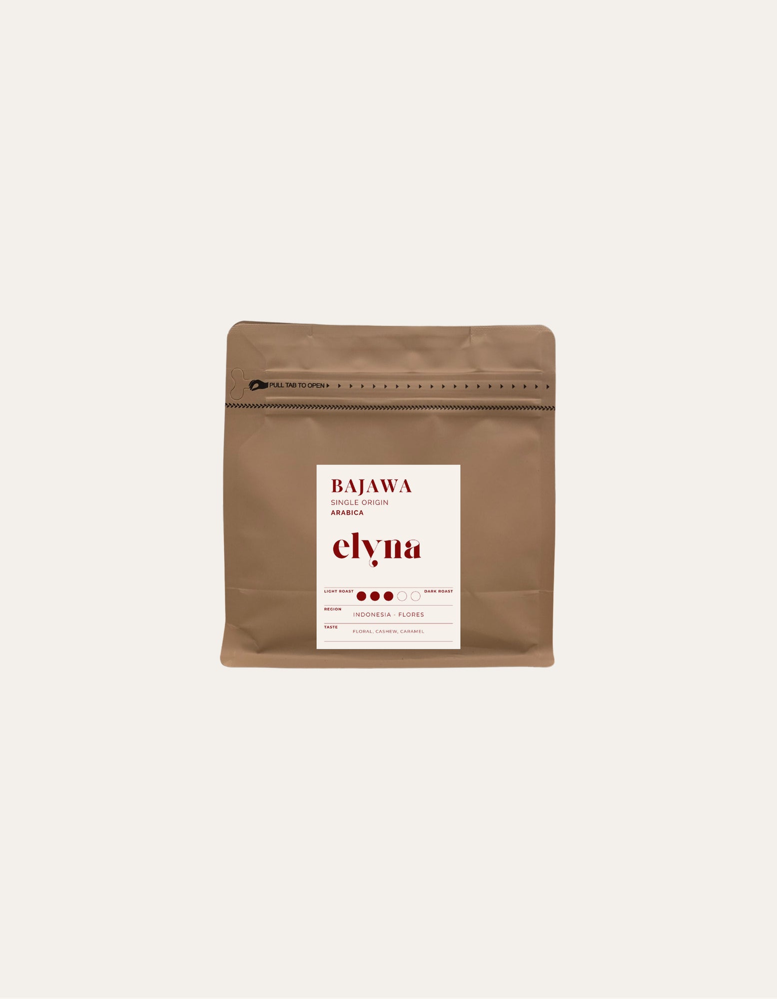Brown coffee packaging with a white label on a beige background