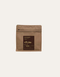 Brown coffee bag with 'Sindoro' and 'Elyna' branding on a beige background